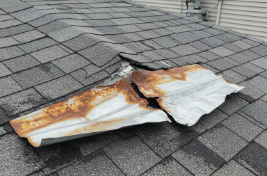Damaged roof flashing on a rooftop